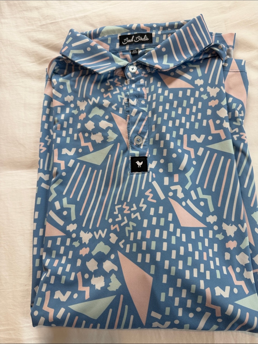 Bad Birdie Blue Abstract Pattern Polo with Pink and Mint Accents